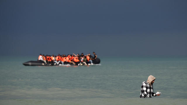 Migrants attempt to cross the English Channel, on the beach of the Slack dunes in Wimereux 