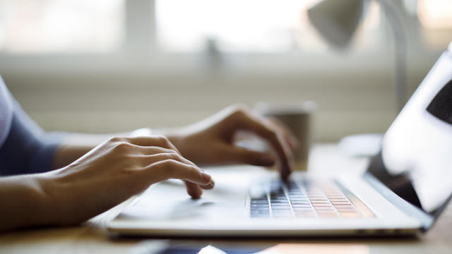 Woman using her laptop for working from home 