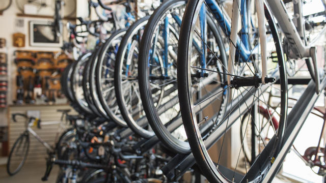 Bicycles hanging on rack in store 